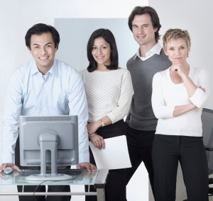 Smiling Business Team at Computer